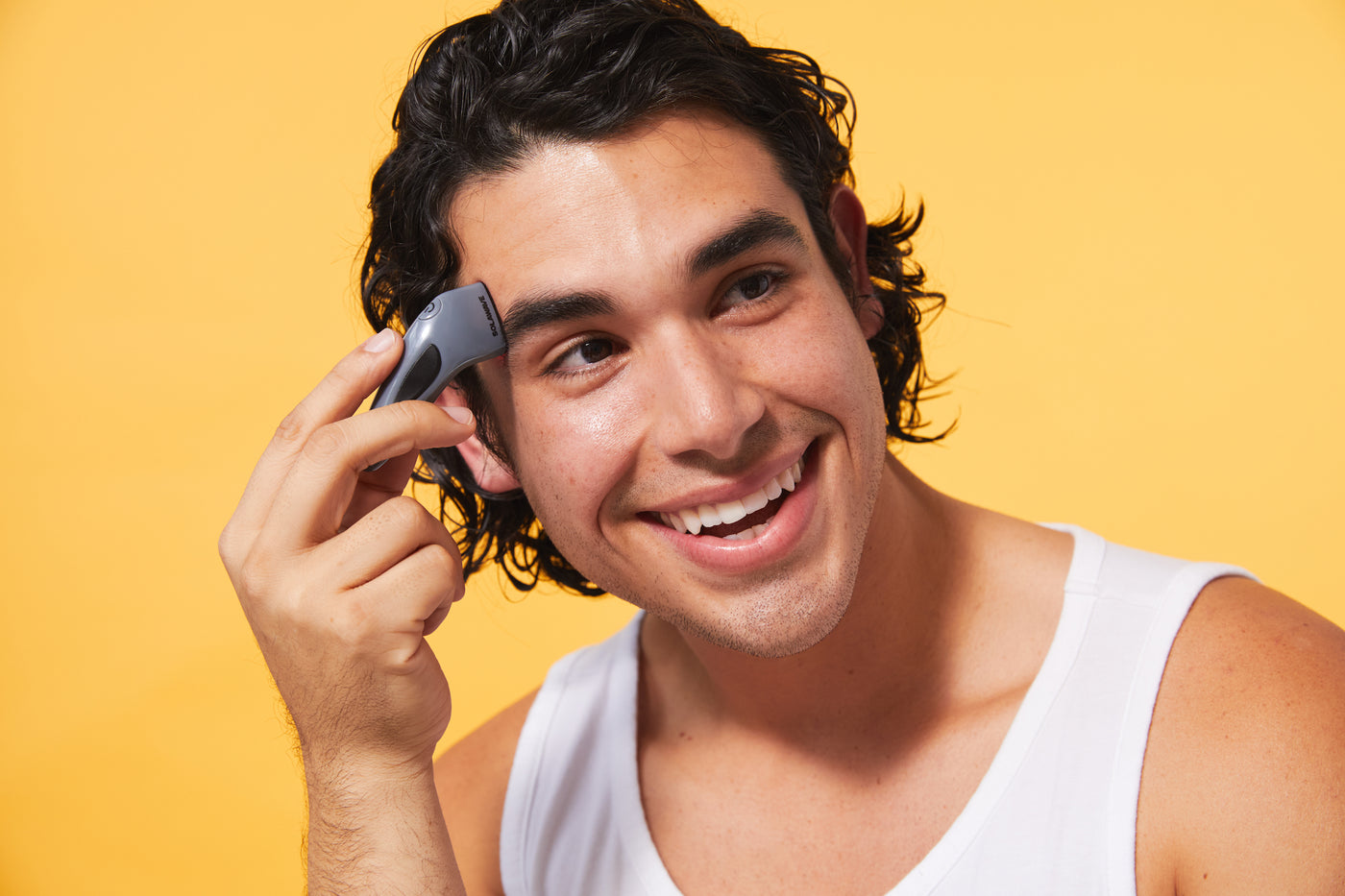 An image of a man using the blue light therapy device