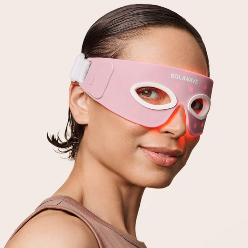 An image of a woman wearing the Solawave red light therapy eye mak