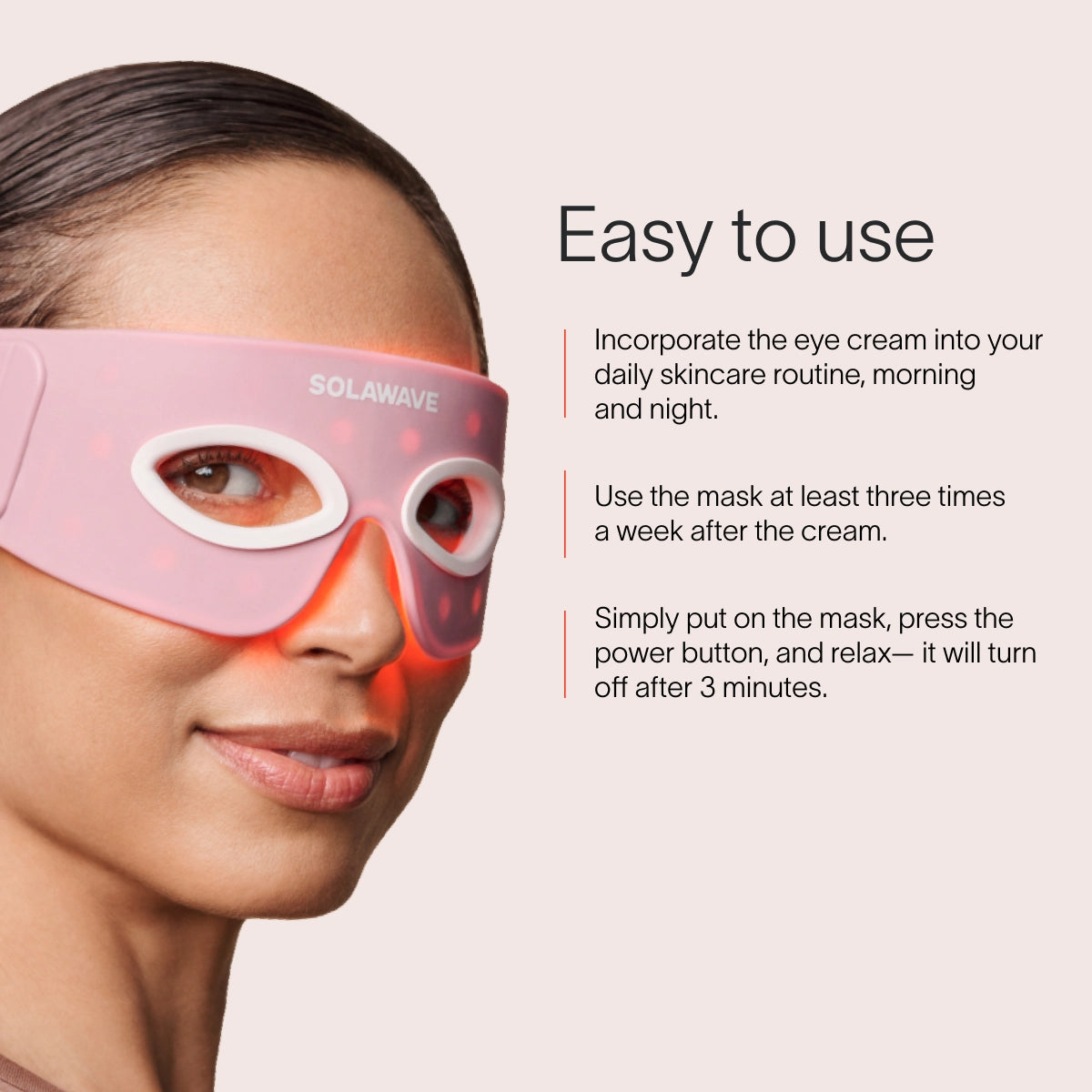 Someone is wearing a pink SolaWave Eye Recovery Pro Kit LED mask, featuring LightBoost technology and emitting a red glow. Instructions suggest incorporating it into your skincare routine three times a week; it automatically shuts off after three minutes.