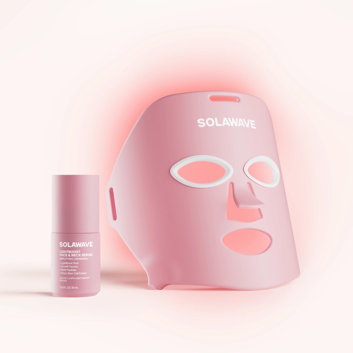 A person using a pink skincare device on their forehead with dotted lines.