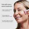 A person smiles while using a skincare wand, following instructions to apply 1-2 pumps of Solawaves LightBoost Wand Activating Serum, enriched with hyaluronic acid for better glide and to support Galvanic Current. Do not wash off; continue with your normal skincare routine.