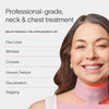 A smiling woman with long hair wears a pink Neck & Chest LED Mask. Text reads: Solawave: Neck & Chest LED Mask w/ LightBoost Cream Kit. Benefits include reducing fine lines, wrinkles, creases, uneven texture, and sagging using advanced red light therapy.