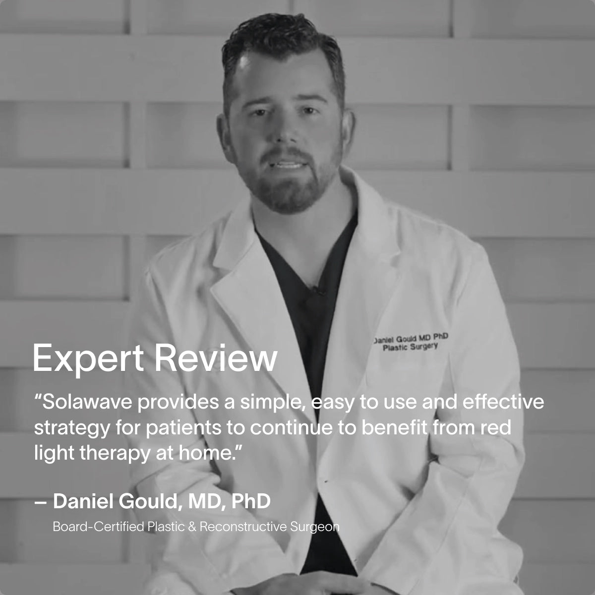 In a monochrome image, a board-certified plastic and reconstructive surgeon reviews Solawaves 4-in-1 Red Light Therapy Wand & Activating Serum Kit, praising its effective red light therapy for enhancing collagen production at home. || Gold