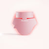 The Solawave Neck & Chest Rejuvenating Mask, shown with glowing red light on a neutral background, is perfect for fans of light therapy masks seeking effective skin-firming treatments. || Rose